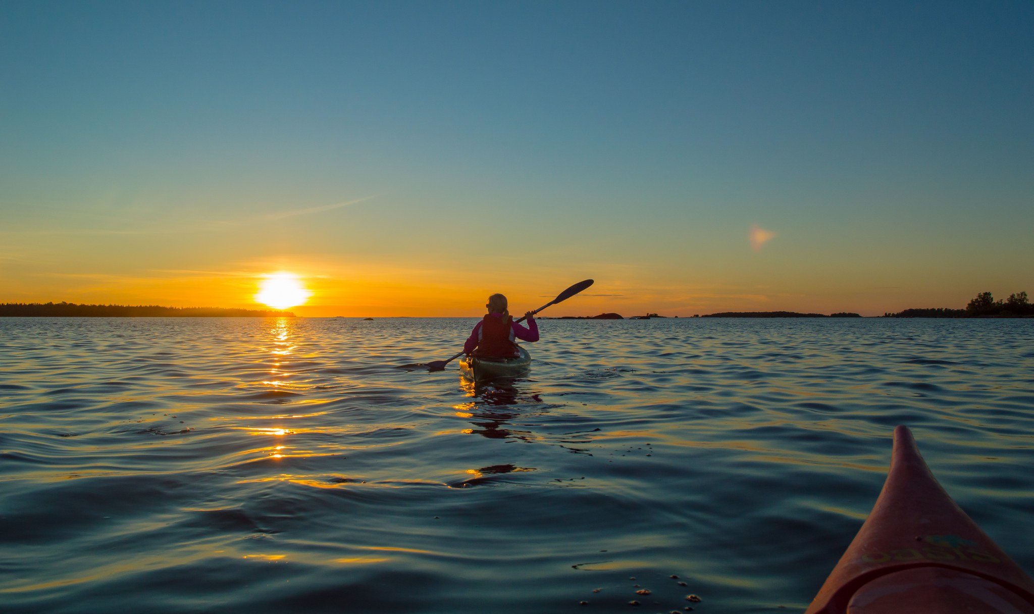 Canoeist at sunset by Kalajoki seaside