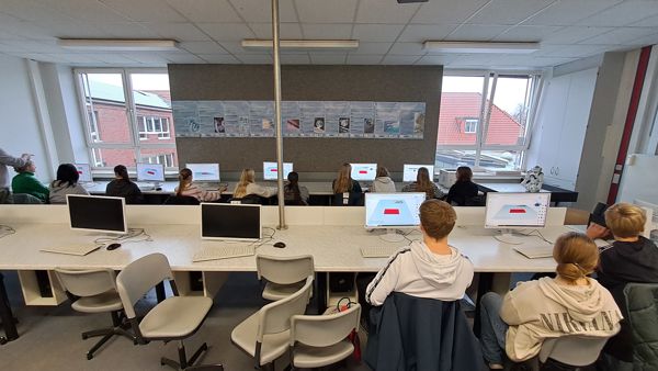 students with computers in a classroom