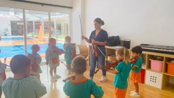 Students playing violins