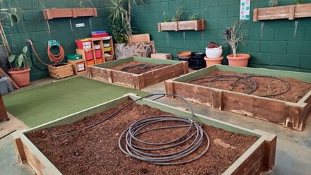 School garden with flower pots