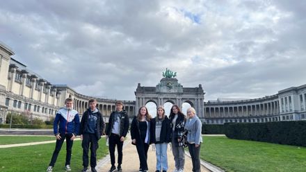 students in front of an old castle