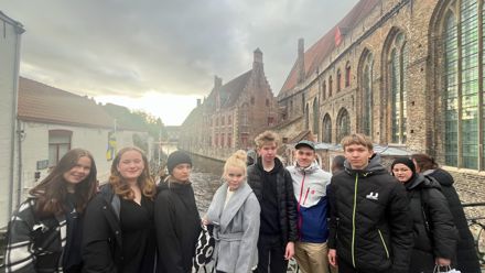 students in front of an old building