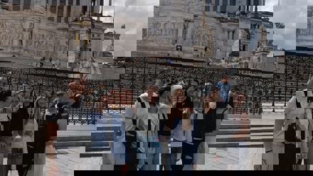 Students in front of a white building