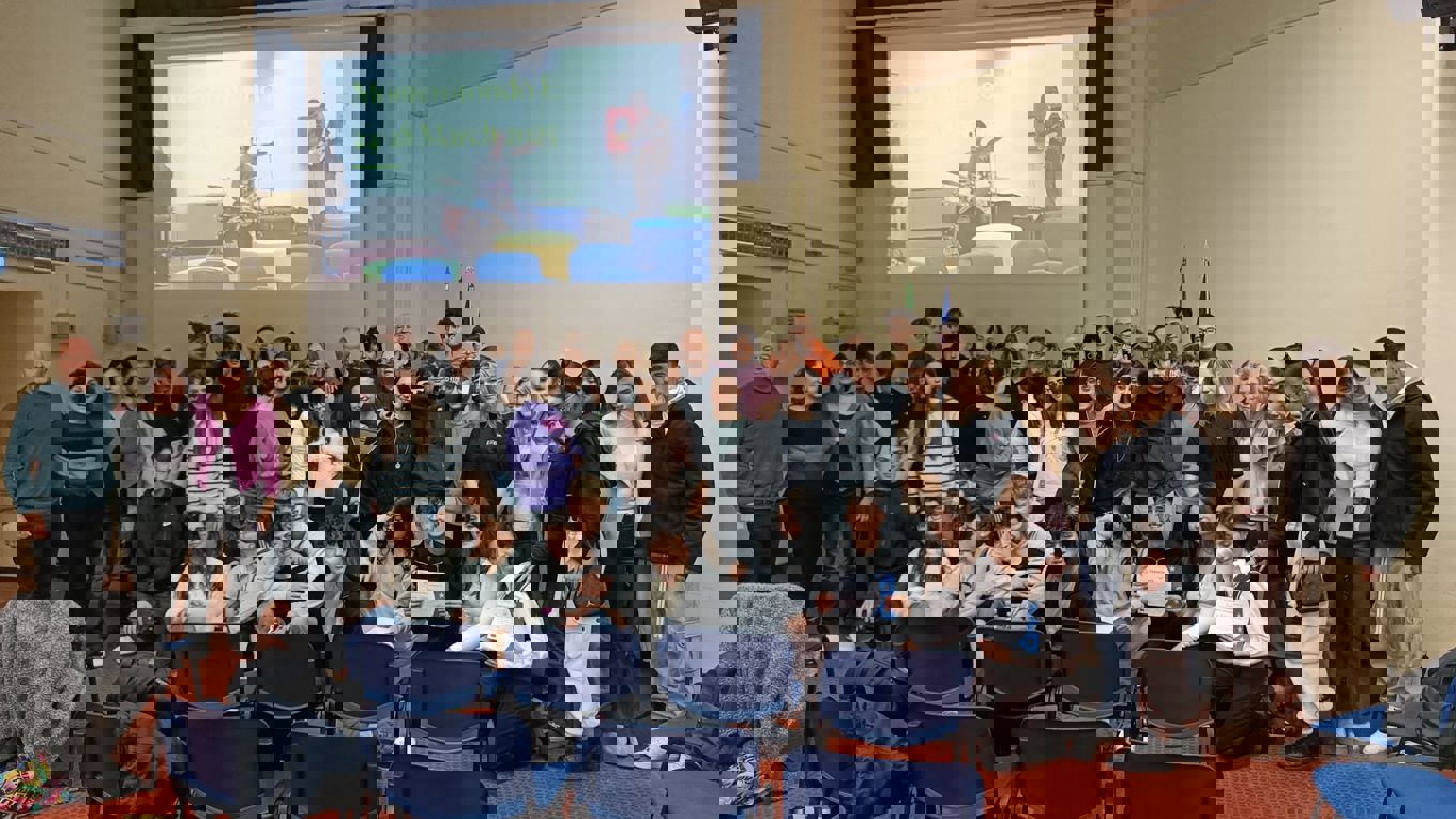 Group of students in front of a screen