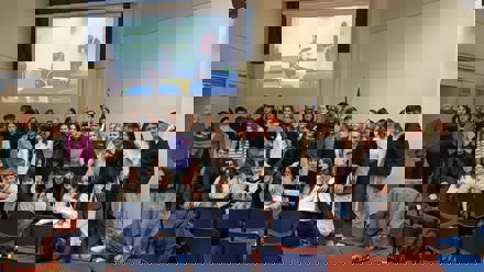 Group of students in front of a screen